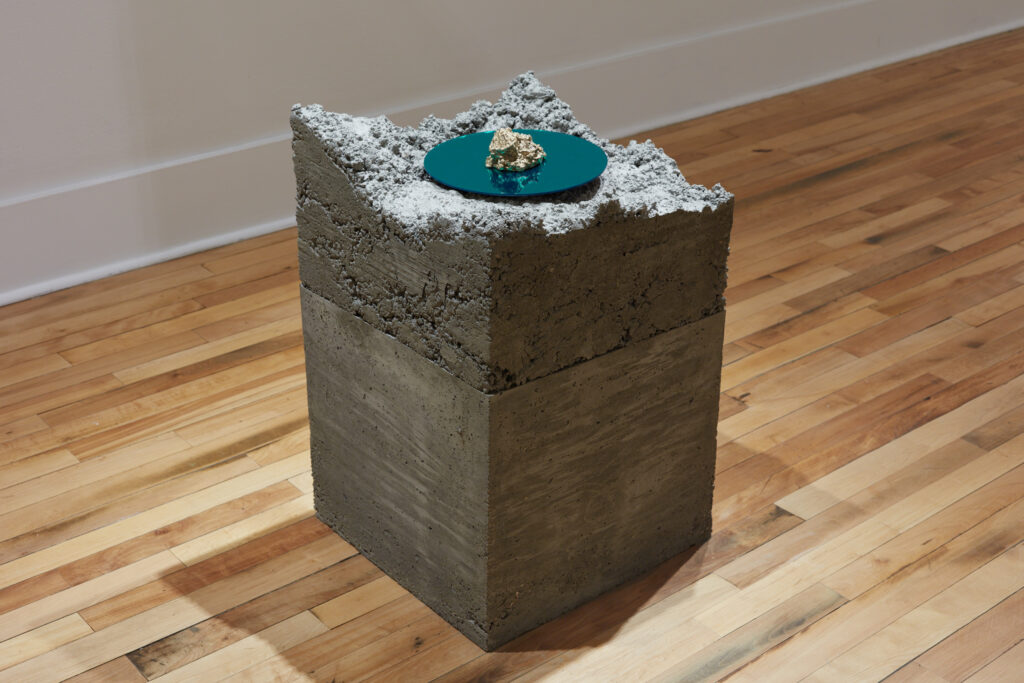 minimalist art installation of concrete and plexiglass contemporary sculpture