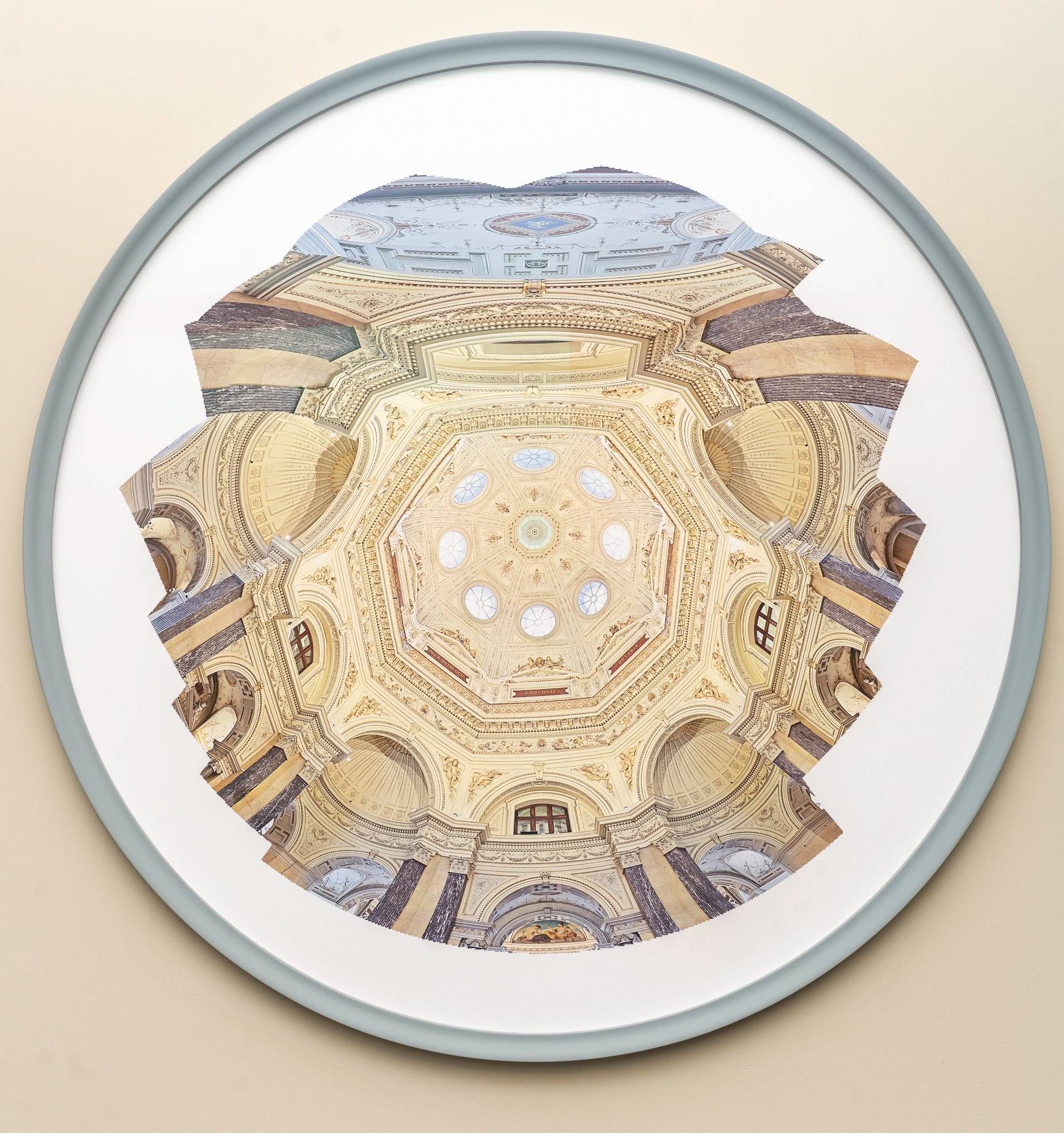 A print looking upwards to the underside of an architectural golden, cream, and blue cathedral dome with eight arched windows and rich ceiling details.