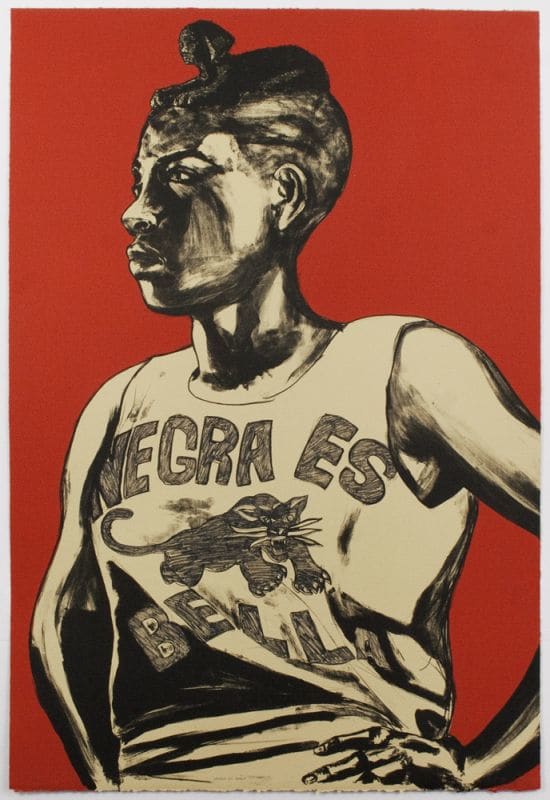 A lithograph of a woman standing in front of a red background with her hands on her hips, wearing a tank top that reads, "Negra es Bella"with an image of a black panther in the middle.