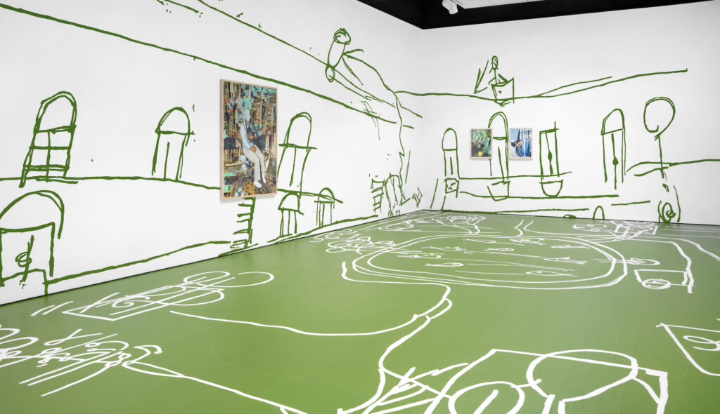 Installation view of white walls decorated with large green abstract sketches. One artwork hangs on the left wall, two on the right. The floor is green with white abstract sketches.