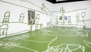 Installation view of white walls decorated with large green abstract sketches. One artwork hangs on the left wall, two on the right. The floor is green with white abstract sketches.