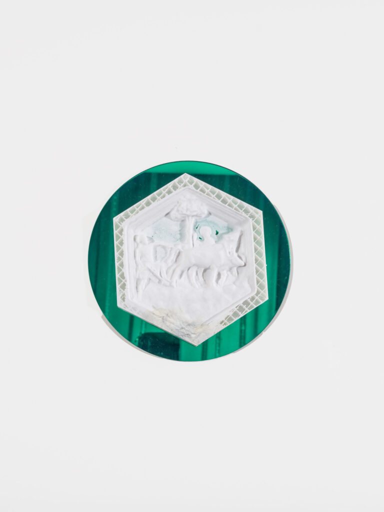 A green reflective circle is behind a white hexagon. The hexagon has a lattice border and figures in the center.